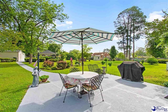 view of patio with a shed, a gazebo, and area for grilling