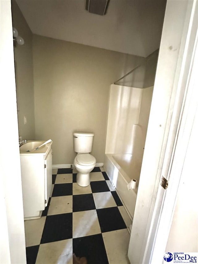 full bathroom featuring baseboards, toilet, tile patterned floors, tub / shower combination, and vanity