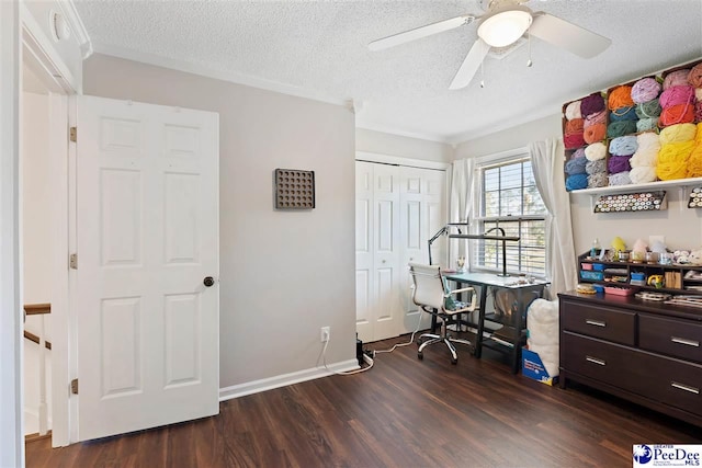 office with a textured ceiling, ceiling fan, baseboards, dark wood finished floors, and crown molding