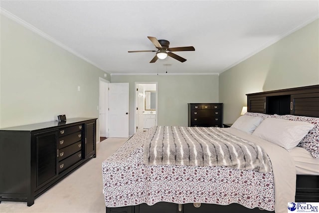 bedroom with ornamental molding, light carpet, ceiling fan, and ensuite bath