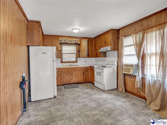 515 W Darlington St, Florence, SC 29501 - kitchen with white appliances, a sink, light countertops, wood walls, and under cabinet range hood