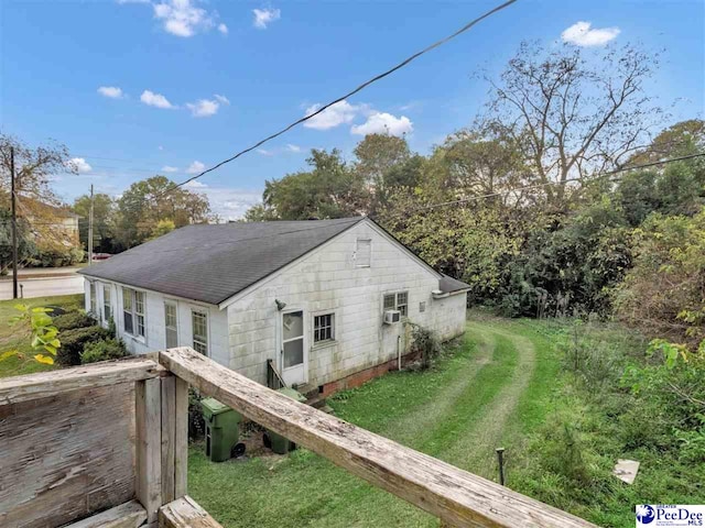 515 W Darlington St, Florence, SC 29501 - back of house with concrete block siding, cooling unit, a yard, a shingled roof, and crawl space