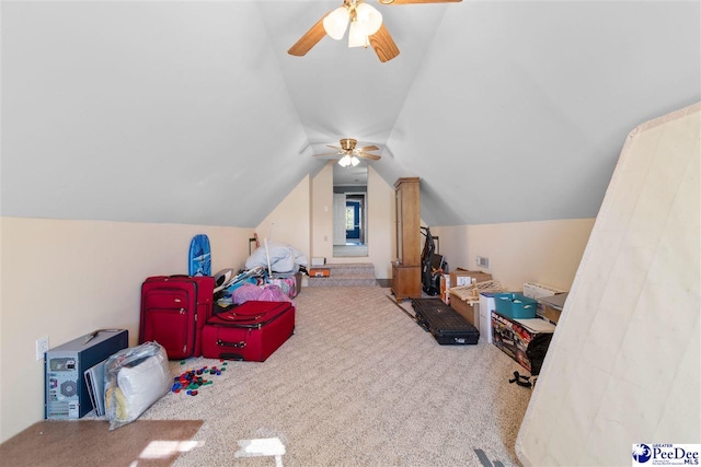 recreation room with lofted ceiling, carpet floors, and ceiling fan