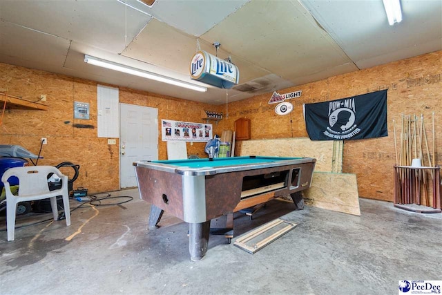 recreation room with pool table and unfinished concrete floors