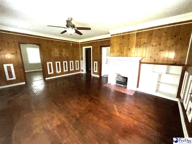 251 Papermill Rd, Florence, SC 29506 - unfurnished living room with crown molding, ceiling fan, wood finished floors, and wood walls
