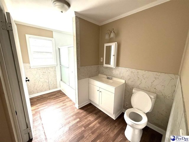 251 Papermill Rd, Florence, SC 29506 - bathroom with wood finished floors, vanity, toilet, crown molding, and wainscoting
