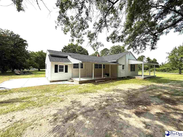 251 Papermill Rd, Florence, SC 29506 - view of front of house with a front lawn