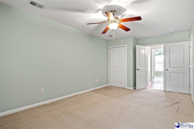 121 Parmelee Dr, Murrells Inlet, SC 29576 - unfurnished bedroom featuring light carpet, a closet, and ceiling fan
