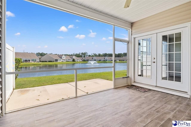 121 Parmelee Dr, Murrells Inlet, SC 29576 - unfurnished sunroom featuring a water view, french doors, and a residential view