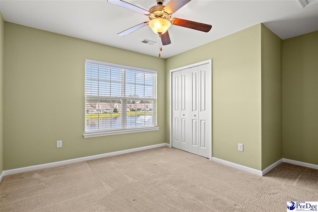 121 Parmelee Dr, Murrells Inlet, SC 29576 - unfurnished bedroom featuring carpet floors, a closet, and a ceiling fan