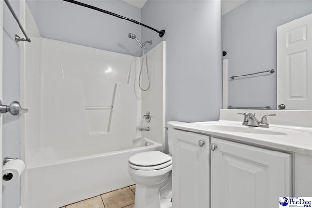 full bath with tile patterned floors,  shower combination, vanity, and toilet
