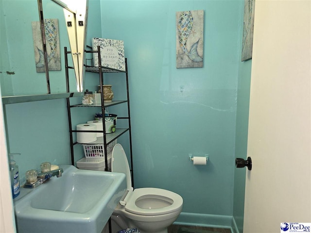 2351 Millers Rd, Mullins, SC 29574 - half bathroom with toilet and a sink