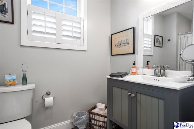 full bath with toilet and vanity