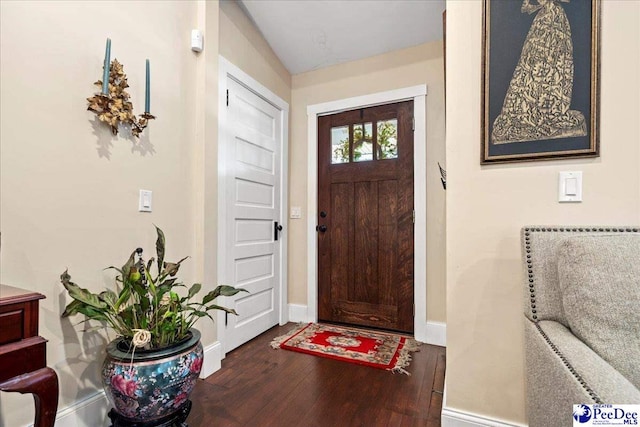 entryway with baseboards and dark wood finished floors