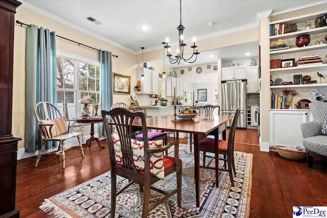 dining room with dark wood-style flooring and crown molding