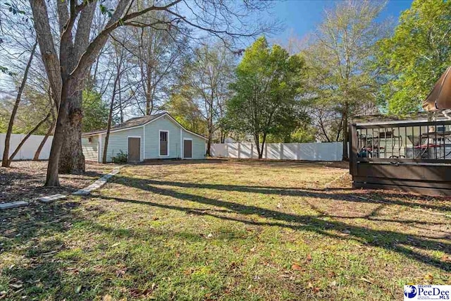 view of yard with a fenced backyard and a deck