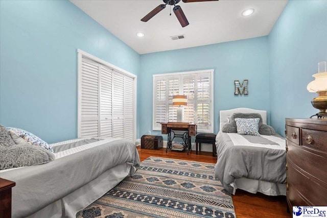 bedroom featuring ceiling fan, visible vents, dark wood finished floors, and recessed lighting