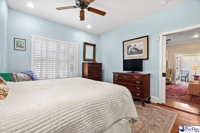 bedroom with baseboards, ceiling fan, light wood-type flooring, and recessed lighting