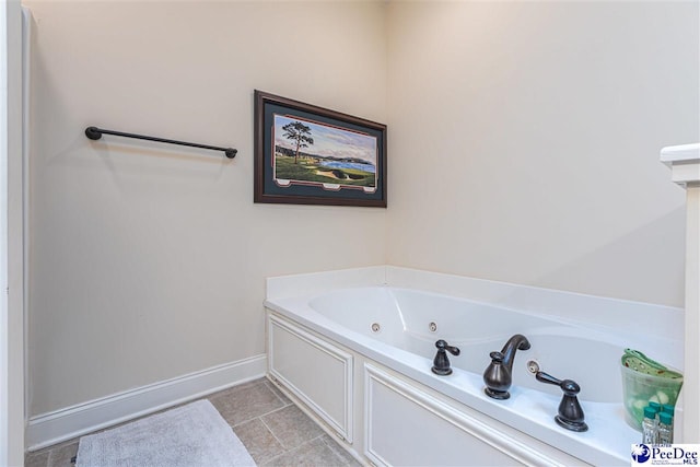 bathroom featuring a tub to relax in and tile patterned floors