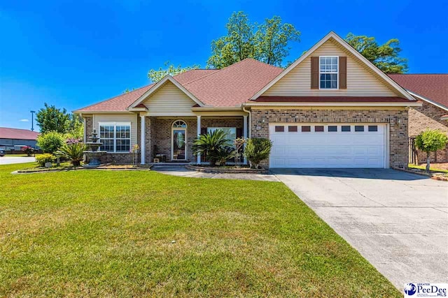 view of front of property featuring a garage and a front yard