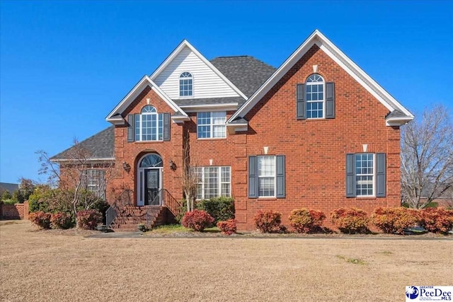 front facade with a front lawn