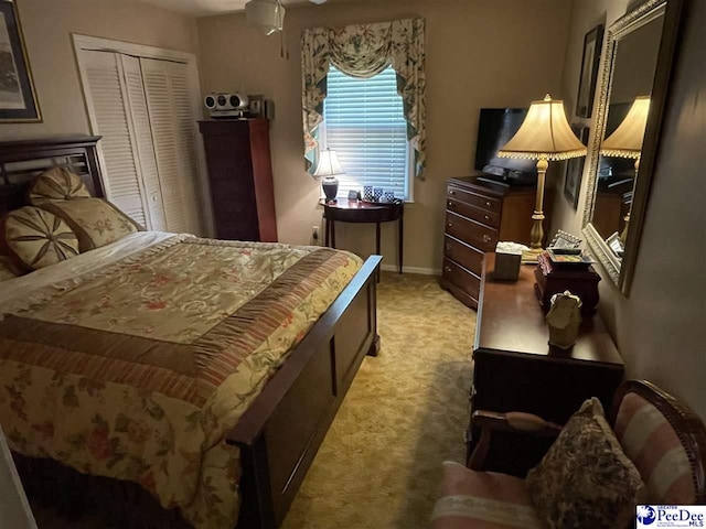 carpeted bedroom with a closet