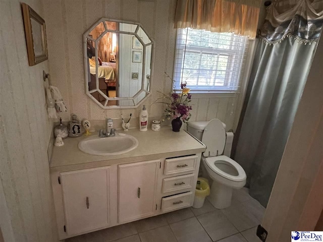 bathroom with vanity, tile patterned flooring, curtained shower, and toilet