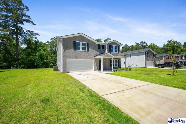 traditional-style home with driveway, a front yard, a garage, brick siding, and central AC