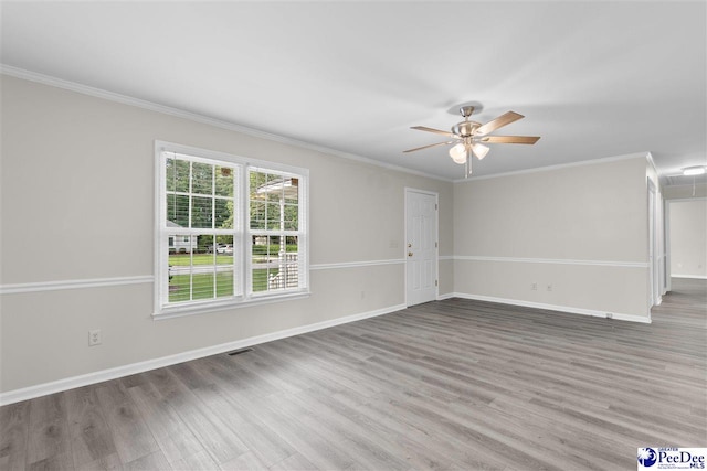 2348 Chadwick Dr, Florence, SC 29501 - unfurnished living room featuring wood finished floors, a ceiling fan, ornamental molding, and attic access
