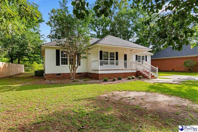 2348 Chadwick Dr, Florence, SC 29501 - view of front facade featuring covered porch, crawl space, and roof with shingles