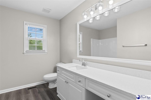2348 Chadwick Dr, Florence, SC 29501 - full bath featuring wood finished floors, vanity, and a shower