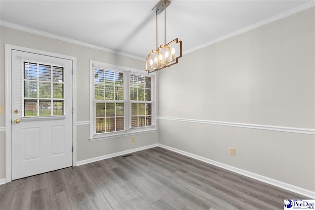 2348 Chadwick Dr, Florence, SC 29501 - unfurnished dining area featuring wood finished floors, crown molding, and a chandelier