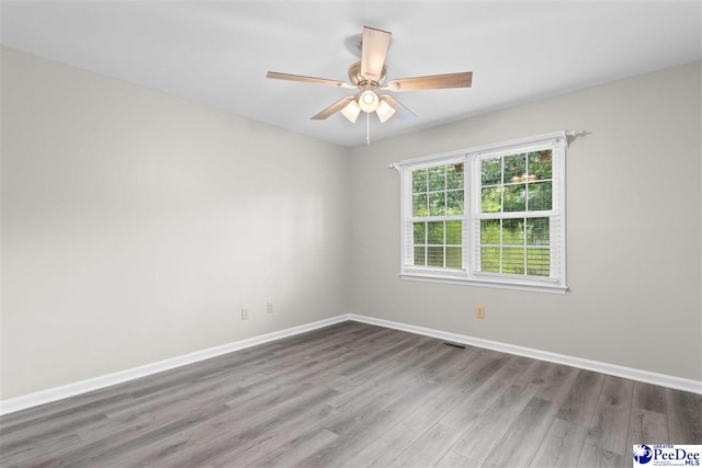 2348 Chadwick Dr, Florence, SC 29501 - empty room with wood finished floors and a ceiling fan