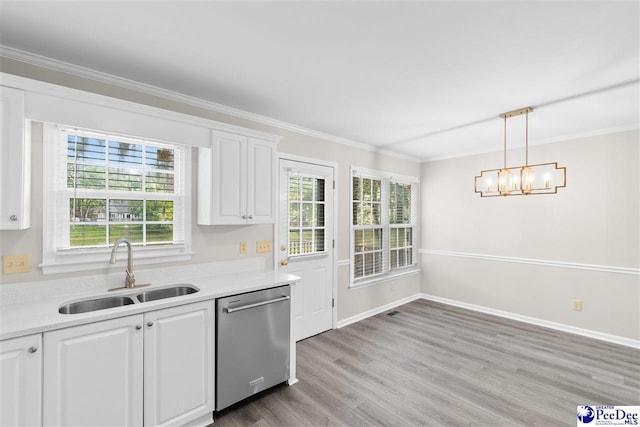 2348 Chadwick Dr, Florence, SC 29501 - kitchen featuring stainless steel dishwasher, ornamental molding, white cabinets, light countertops, and light wood finished floors