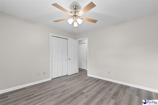 2348 Chadwick Dr, Florence, SC 29501 - unfurnished bedroom with wood finished floors, a closet, and a ceiling fan
