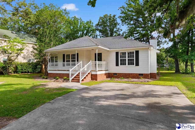 2348 Chadwick Dr, Florence, SC 29501 - view of front facade with a porch, crawl space, a chimney, and a front yard
