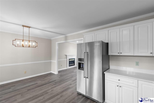 2348 Chadwick Dr, Florence, SC 29501 - kitchen with high end fridge, white cabinets, dark wood finished floors, ornamental molding, and light countertops