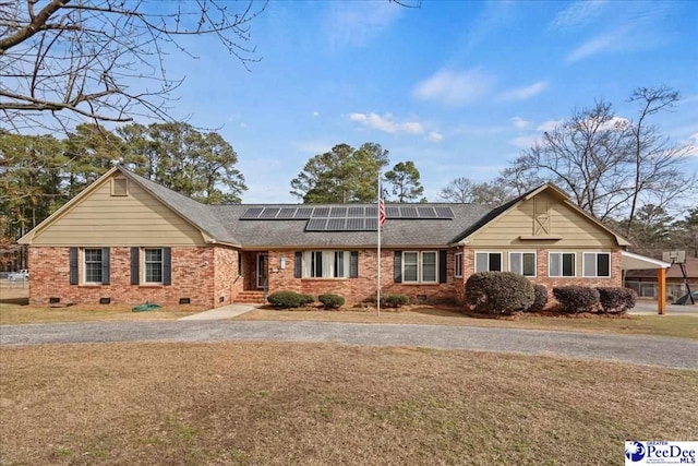 single story home with solar panels