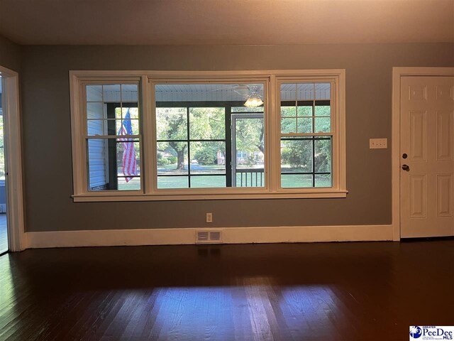 506 W College Ave, Hartsville, SC 29550 - unfurnished room featuring dark wood-style floors and baseboards