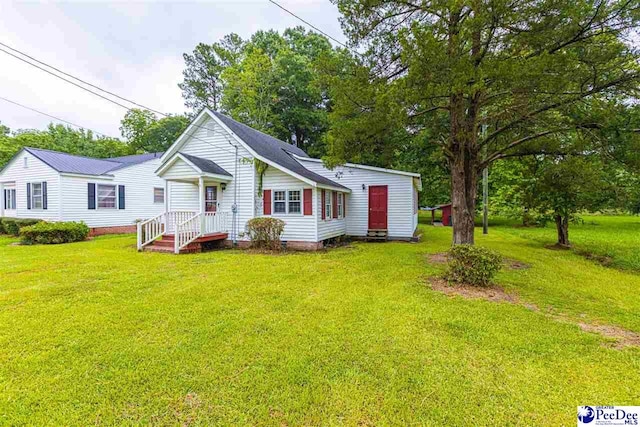 rear view of house with a lawn