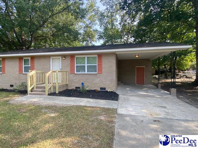 ranch-style home with a carport