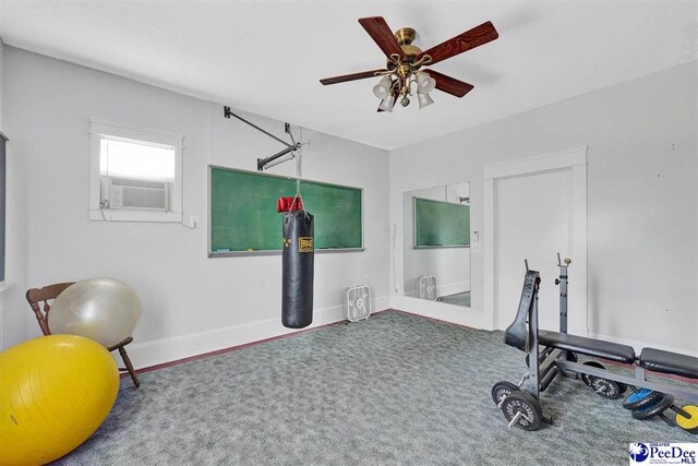 exercise area featuring cooling unit, ceiling fan, and carpet flooring