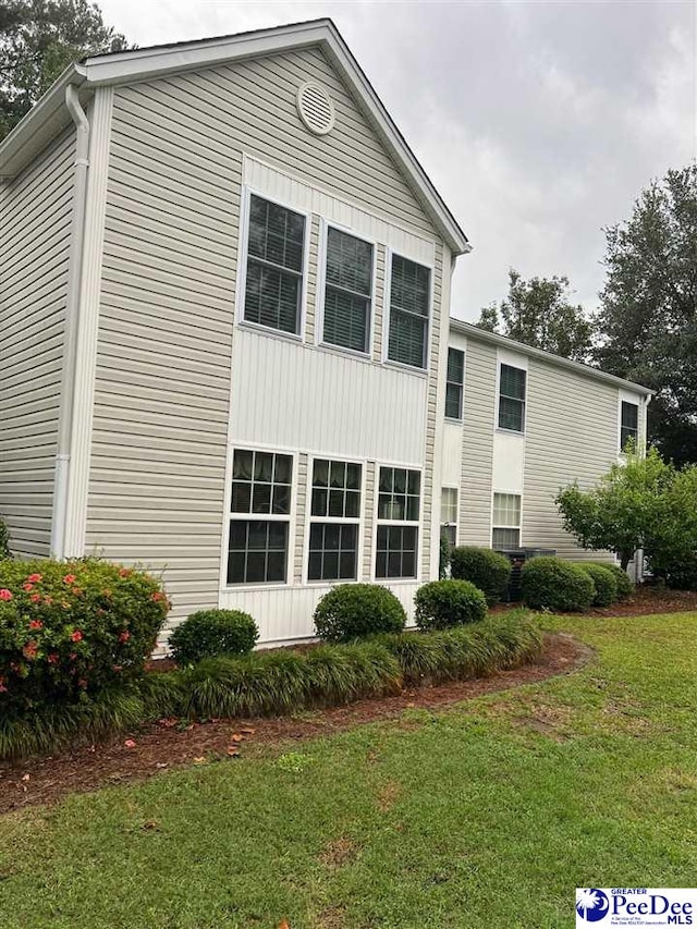 exterior space featuring a front lawn