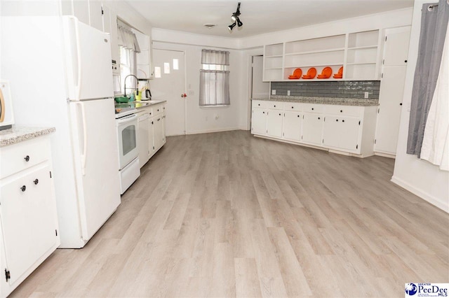 kitchen with sink, white appliances, tasteful backsplash, white cabinets, and light wood-type flooring