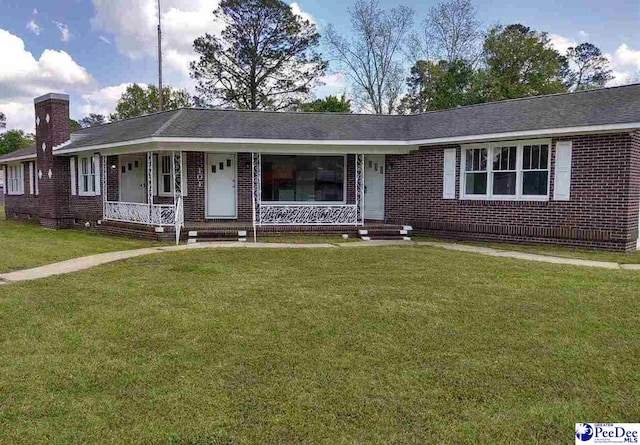 ranch-style house featuring a front yard and a porch