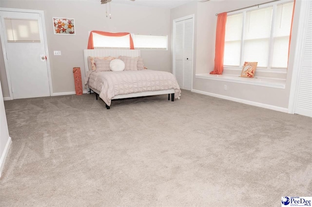 carpeted bedroom featuring a closet