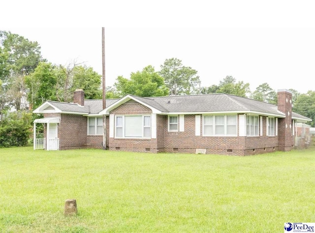 ranch-style house featuring a front yard