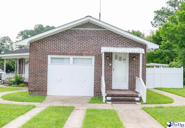 bungalow-style home with a garage