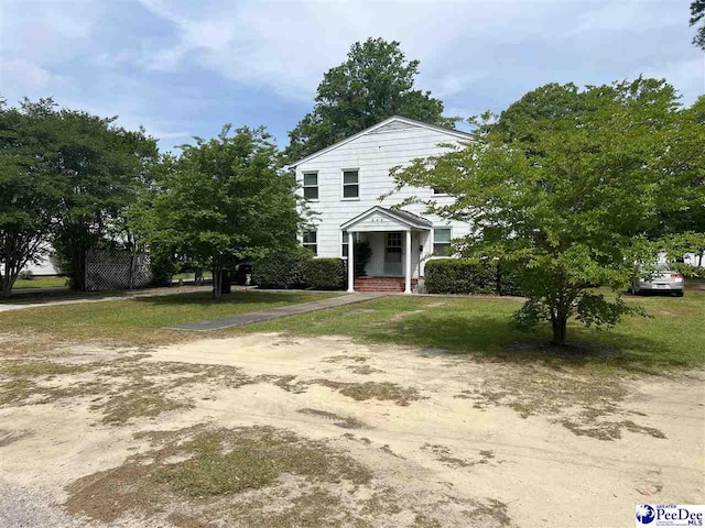 309 E Proctor St, Mullins, SC 29574 - greek revival house with a front lawn