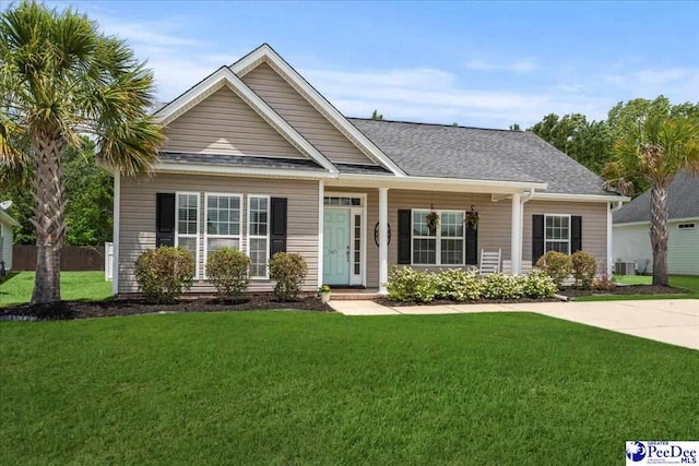 3471 Sweetgrass Dr, Florence, SC 29501 - view of front of property featuring a front lawn and roof with shingles